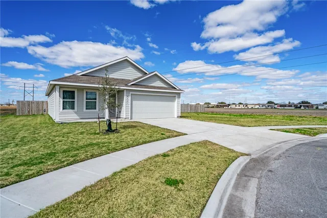 a view of a house with a yard and swimming pool