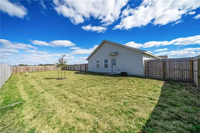 a house view with a garden space