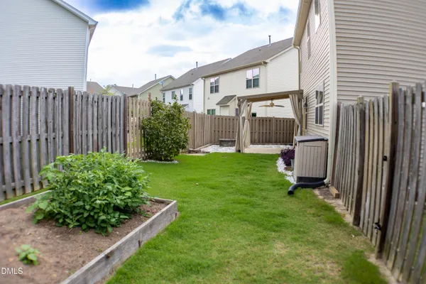 a view of a back yard of the house
