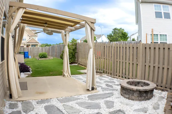a view of a backyard with a small cabin