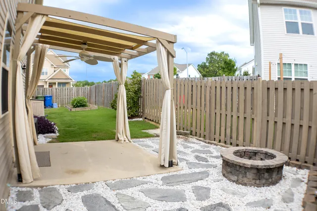 a view of a backyard with a small cabin