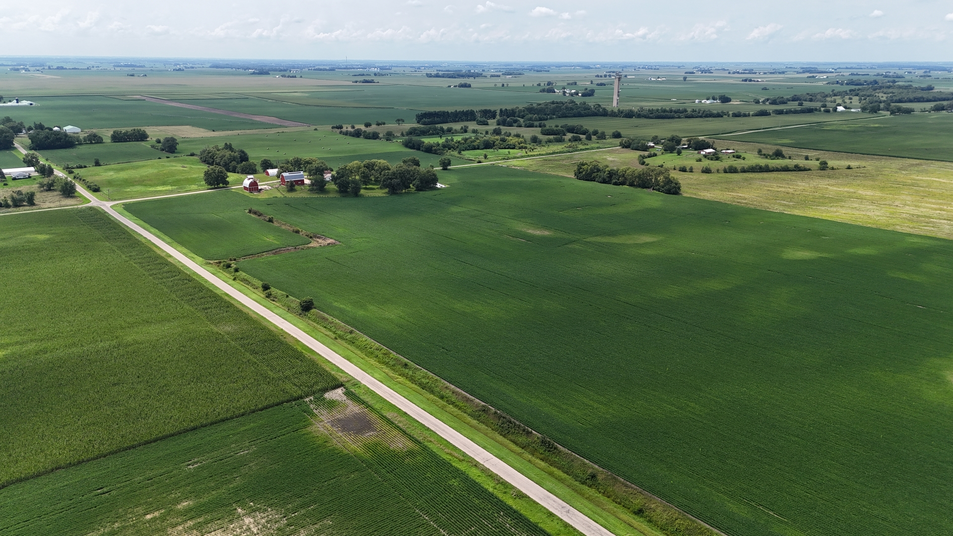 a view of a green field with clear sky