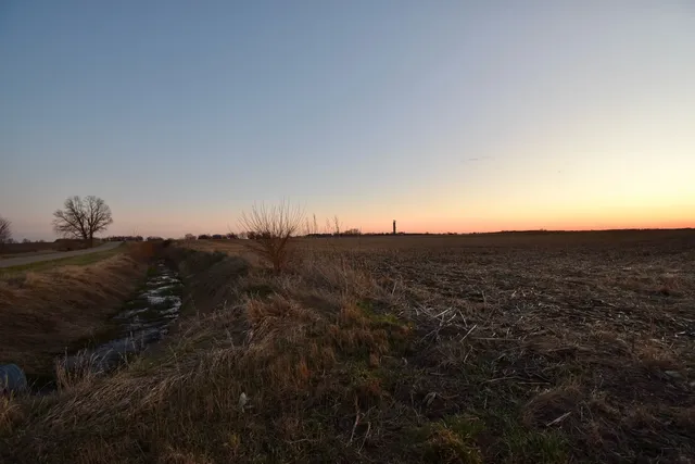 a view of an ocean beach and mountain