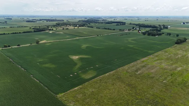 a view of a green field with clear sky