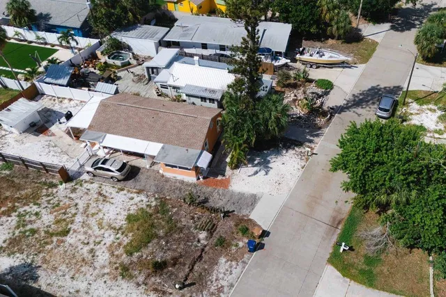 a view of a street with palm trees