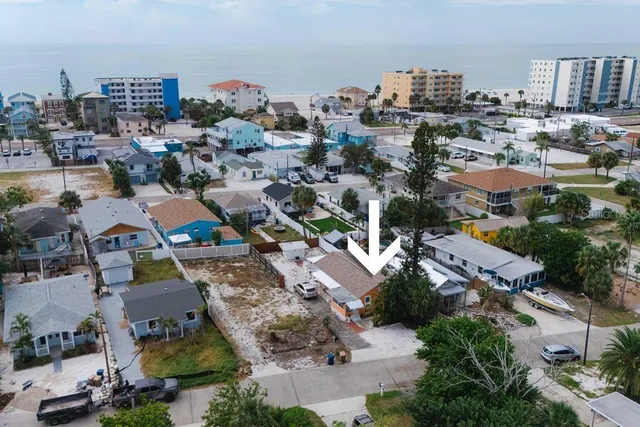 an aerial view of a city with ocean view