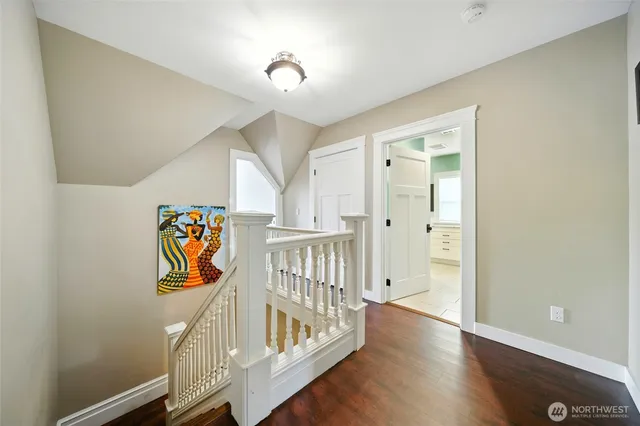a view of an entryway with wooden floor