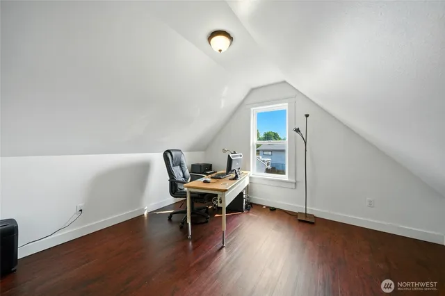 a workspace with furniture and wooden floor
