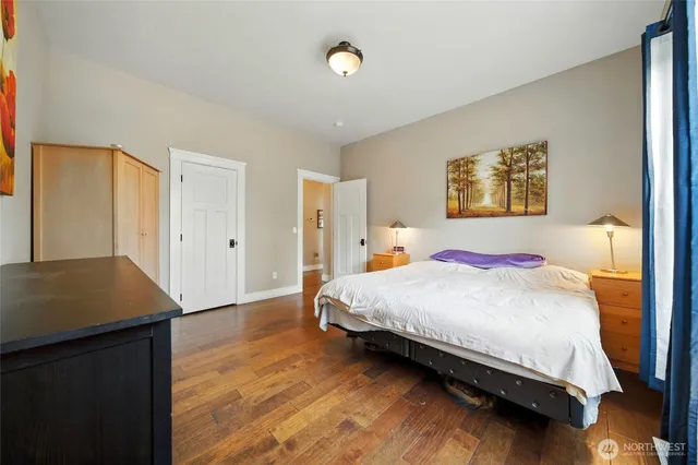 a bedroom with a bed and a table in it