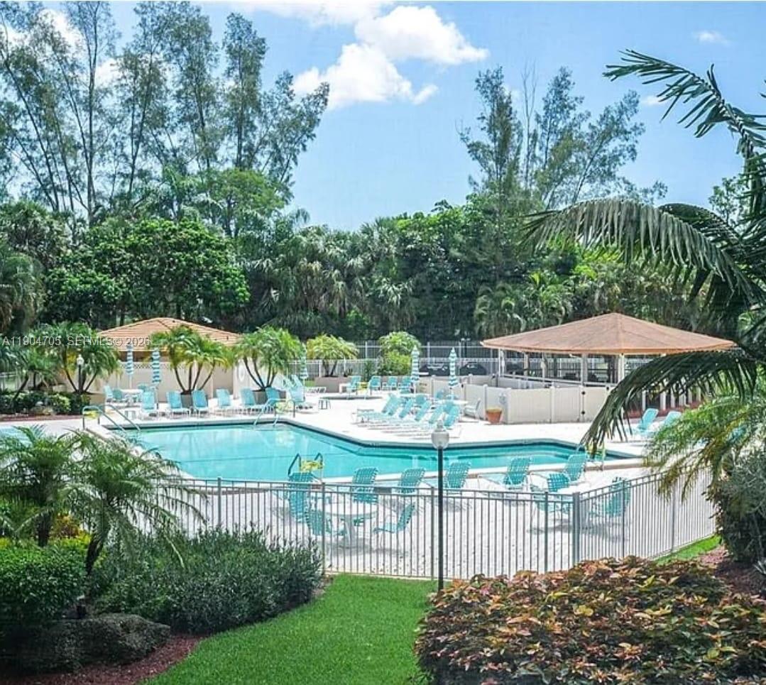 3910 Inverrary Boulevard, Unit 703B Lauderhill, FL 33319 - Photo 7 of 30 a view of a houses with a yard