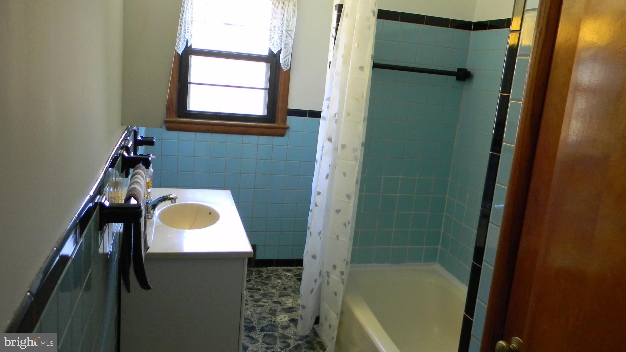 6688 Brocks Gap Road Broadway, VA 22815 - Photo 39 of 81 a bathroom with a sink and a mirror