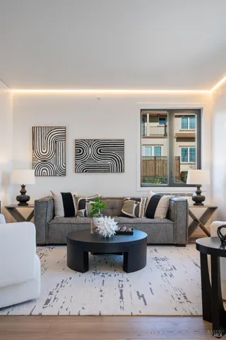 a living room with furniture and a large window