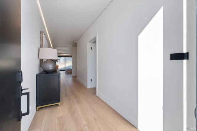 a view of hallway with cabinets