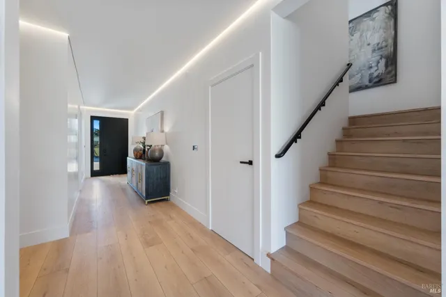 a view of entryway with wooden floor