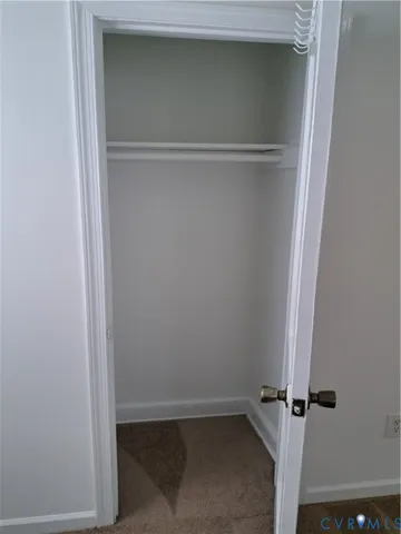 an empty room with mirror