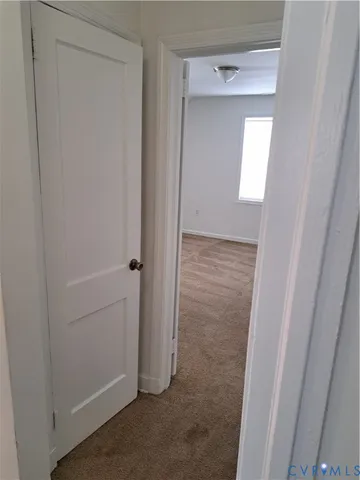 a view of hallway with sink