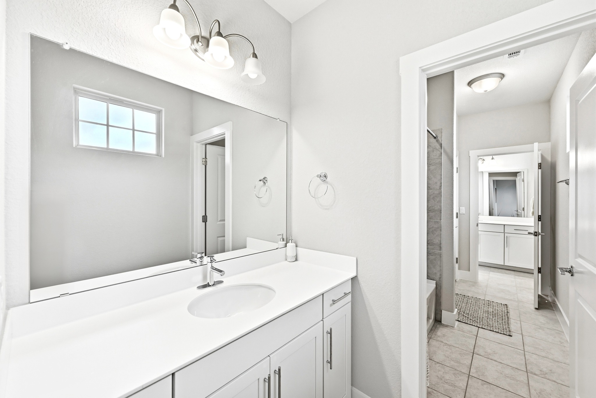 9008 Harper Rae Drive Austin, TX 78717 - Photo 32 of 39 Bathroom featuring a large vanity mirror, single basin sink, and ample counter space