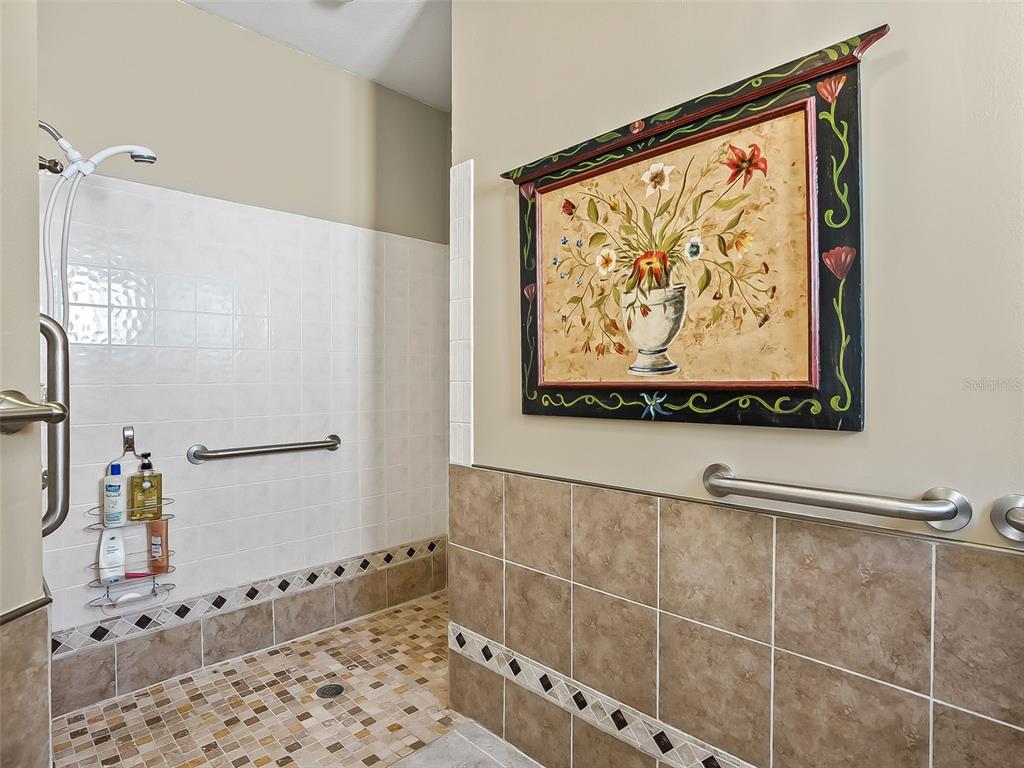 2323 Northwest 55th Avenue Road Ocala, FL 34482 - Photo 19 of 43 a bathroom with a bathtub and a shower