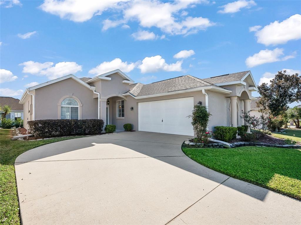 2323 Northwest 55th Avenue Road Ocala, FL 34482 - Photo 2 of 43 a front view of a house with garden