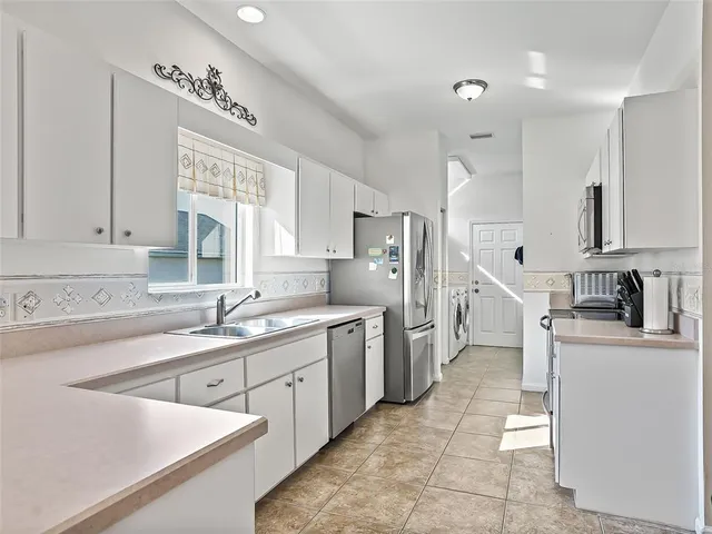 a view of a kitchen with a sink