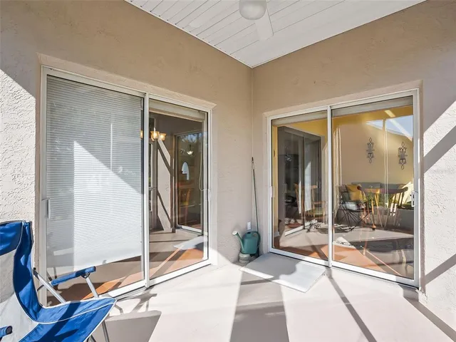 a lobby with furniture and floor to ceiling window