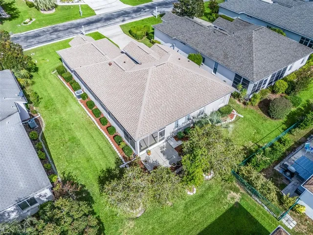 an aerial view of a play ground and trees all around