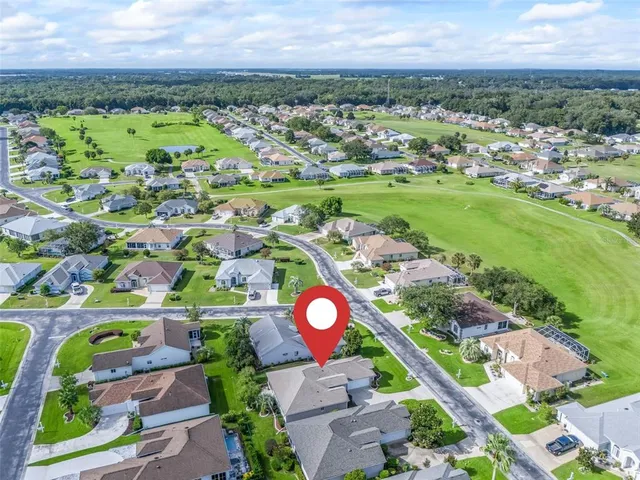 an aerial view of a house with a swimming pool