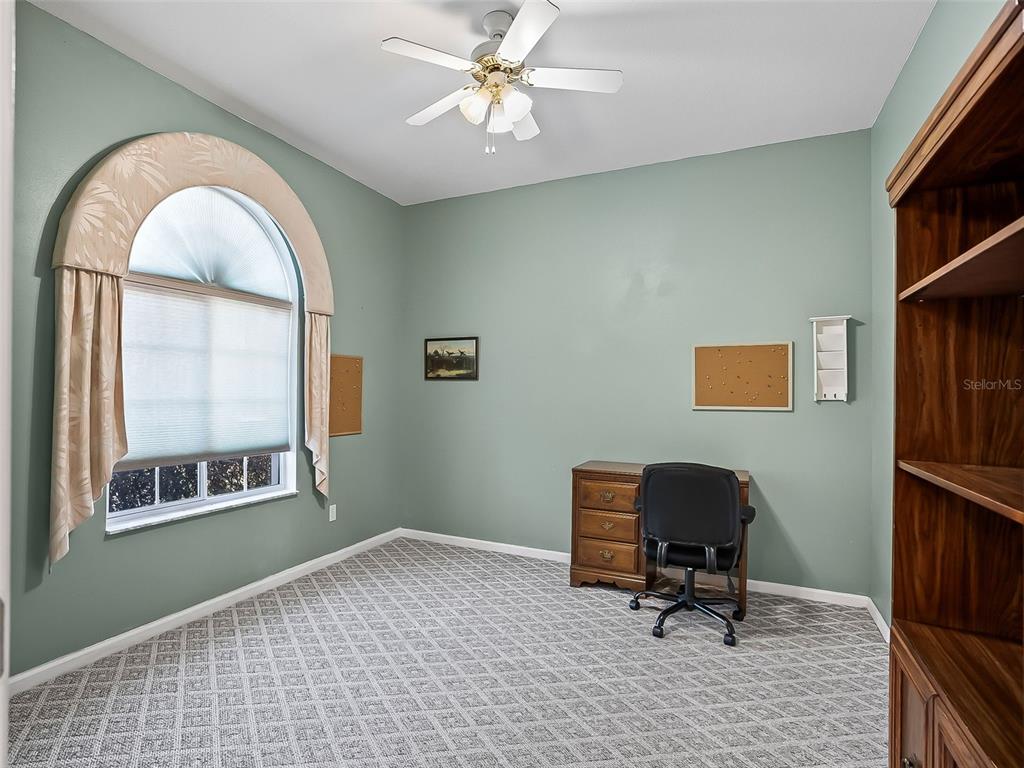 2323 Northwest 55th Avenue Road Ocala, FL 34482 - Photo 5 of 43 a workspace with chandelier