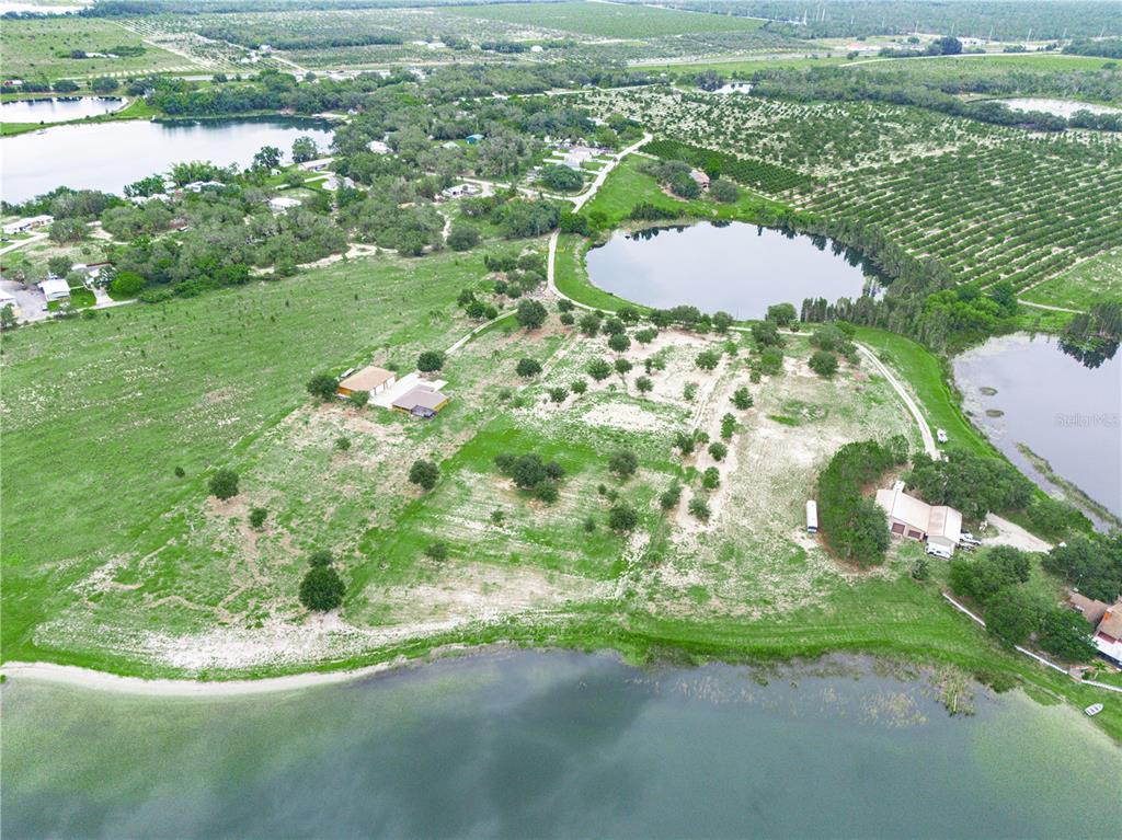 539 Eucalyptus Road Lake Wales, FL 33898 - Photo 8 of 19 a view of a lake with a yard