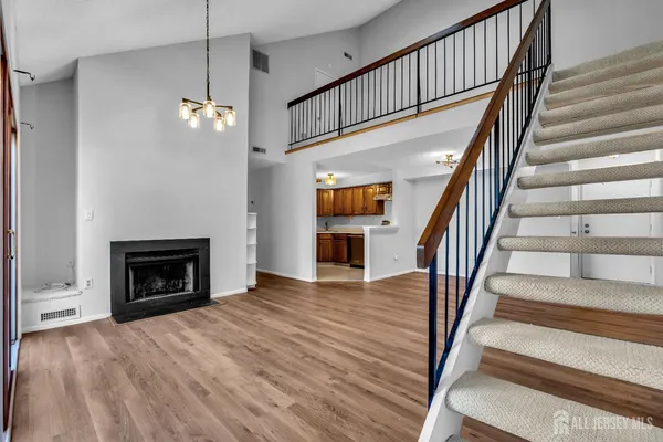 a view of staircase with white walls and a floor to ceiling window