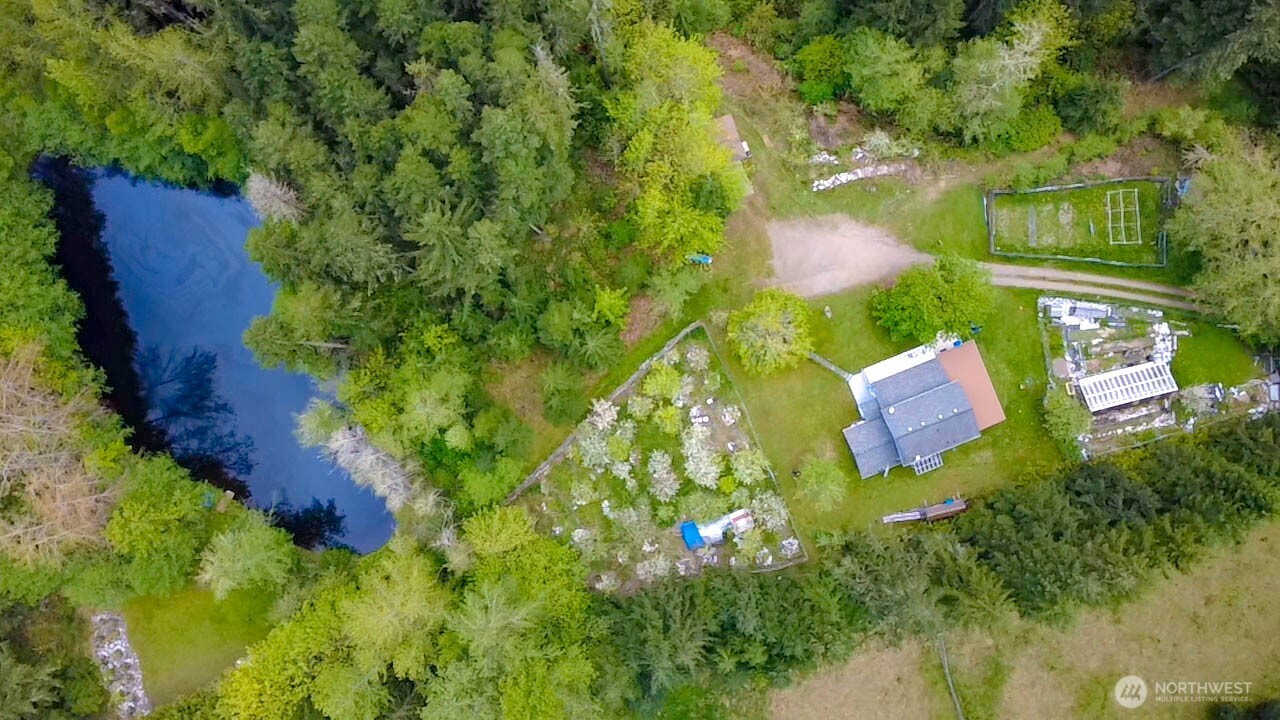 89 Slab Camp Road Sequim, WA 98382 - Photo 3 of 40 an aerial view of residential house with outdoor space and trees all around