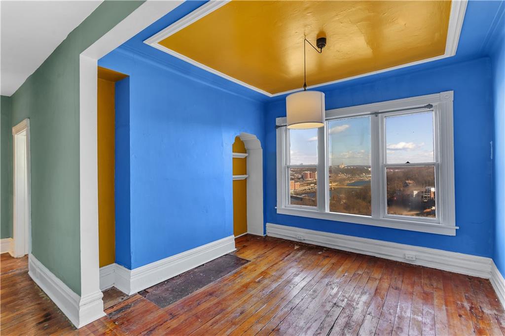 85 Wyoming Street Pittsburgh, PA 15211 - Photo 16 of 33 a view of empty room with wooden floor and fan