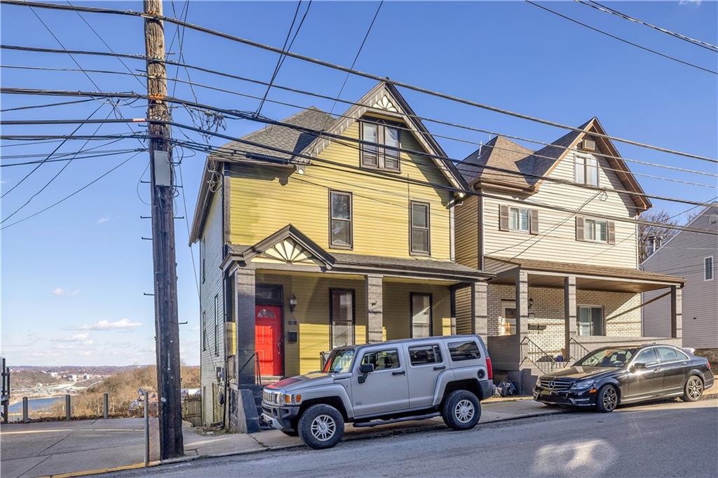 85 Wyoming Street Pittsburgh, PA 15211 - Photo 2 of 33 a car parked in front of a building