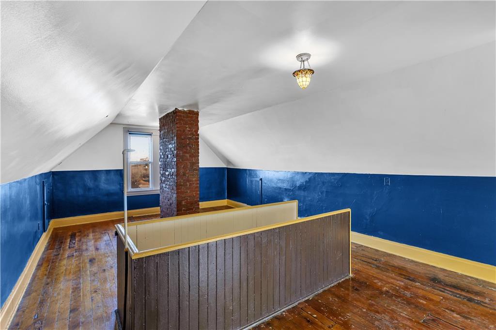 85 Wyoming Street Pittsburgh, PA 15211 - Photo 24 of 33 a view of room with wooden floor