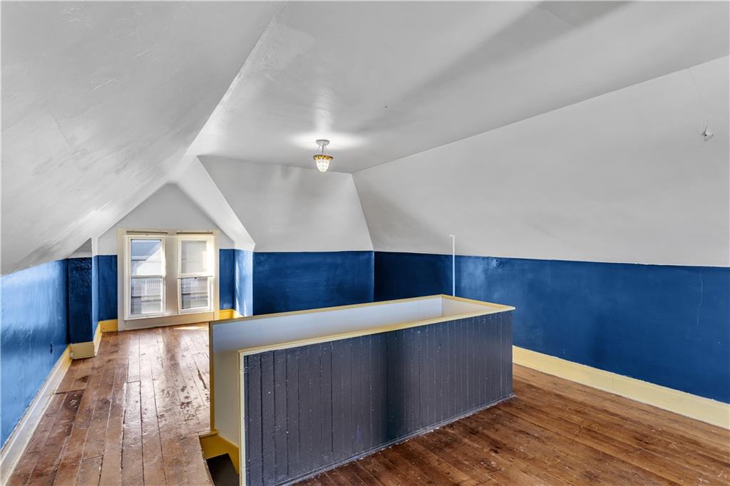 85 Wyoming Street Pittsburgh, PA 15211 - Photo 25 of 33 a view of an empty room with wooden floor