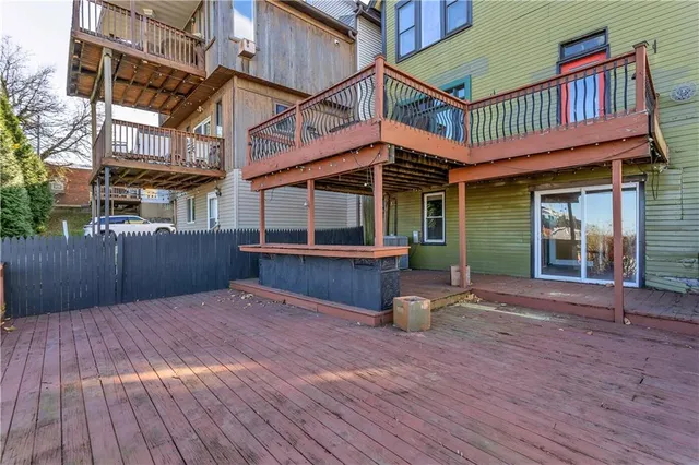 a view of balcony with wooden floor