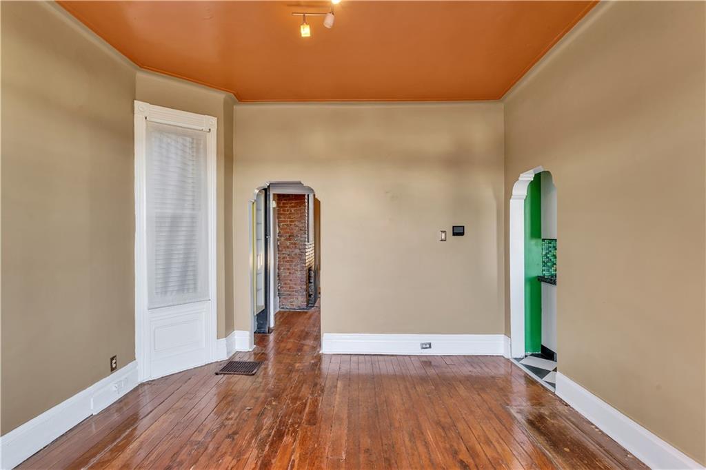 85 Wyoming Street Pittsburgh, PA 15211 - Photo 10 of 33 a view of an empty room with wooden floor