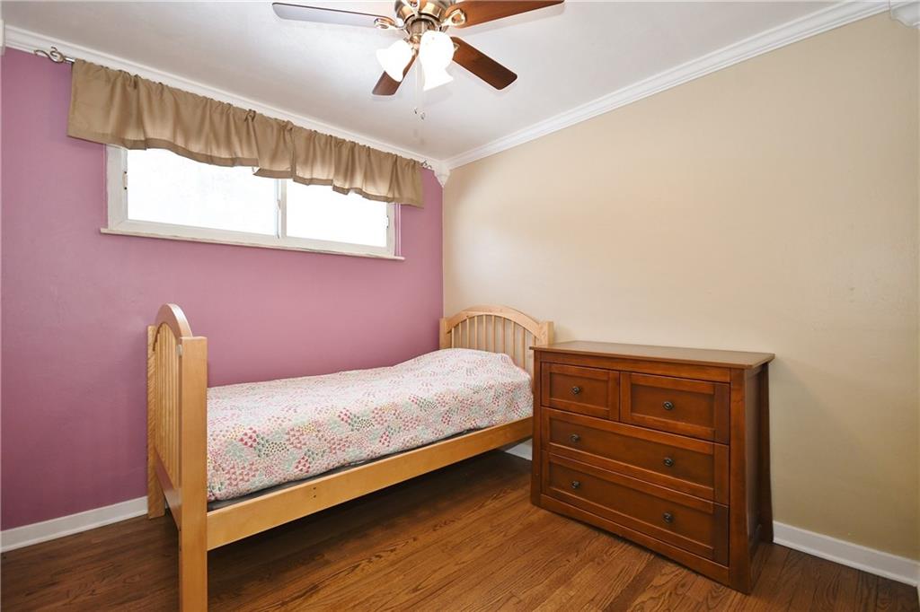 200 West Bruceton Road Pittsburgh, PA 15236 - Photo 14 of 25 Bedroom 2 features painted walls, white trim and a paddle fan to circulate the air. A spacious closet is not shown in this view.