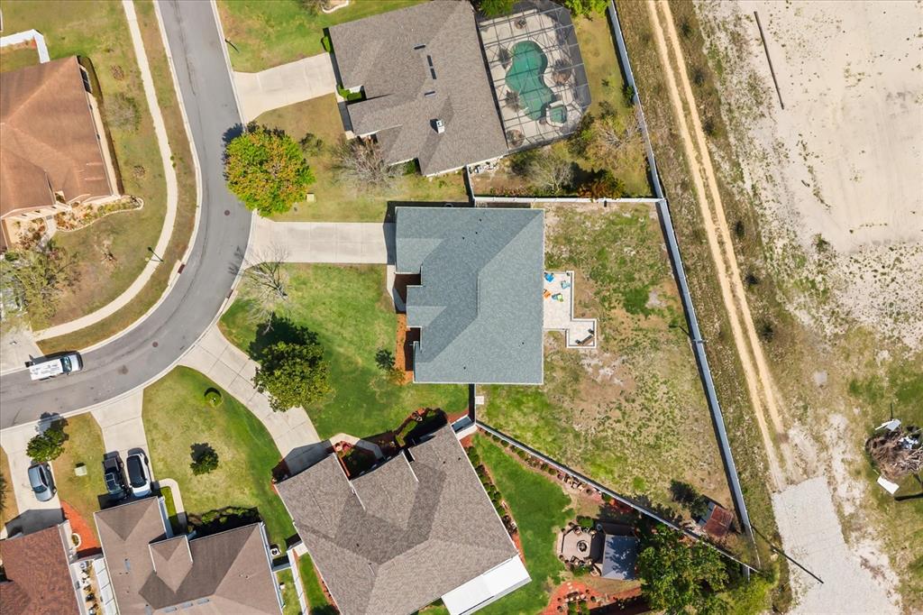2309 Wolf Ridge Lane Mount Dora, FL 32757 - Photo 35 of 36 an aerial view of a house with a yard