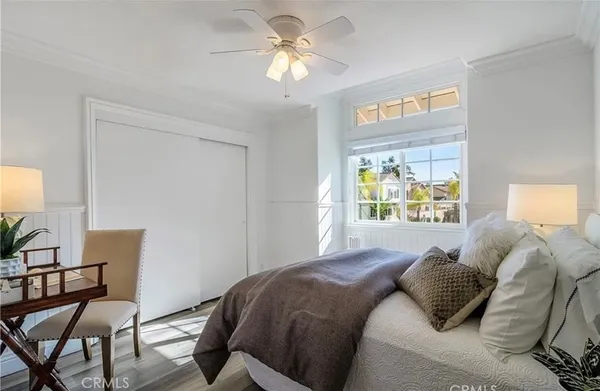 a bedroom with a bed and a chair