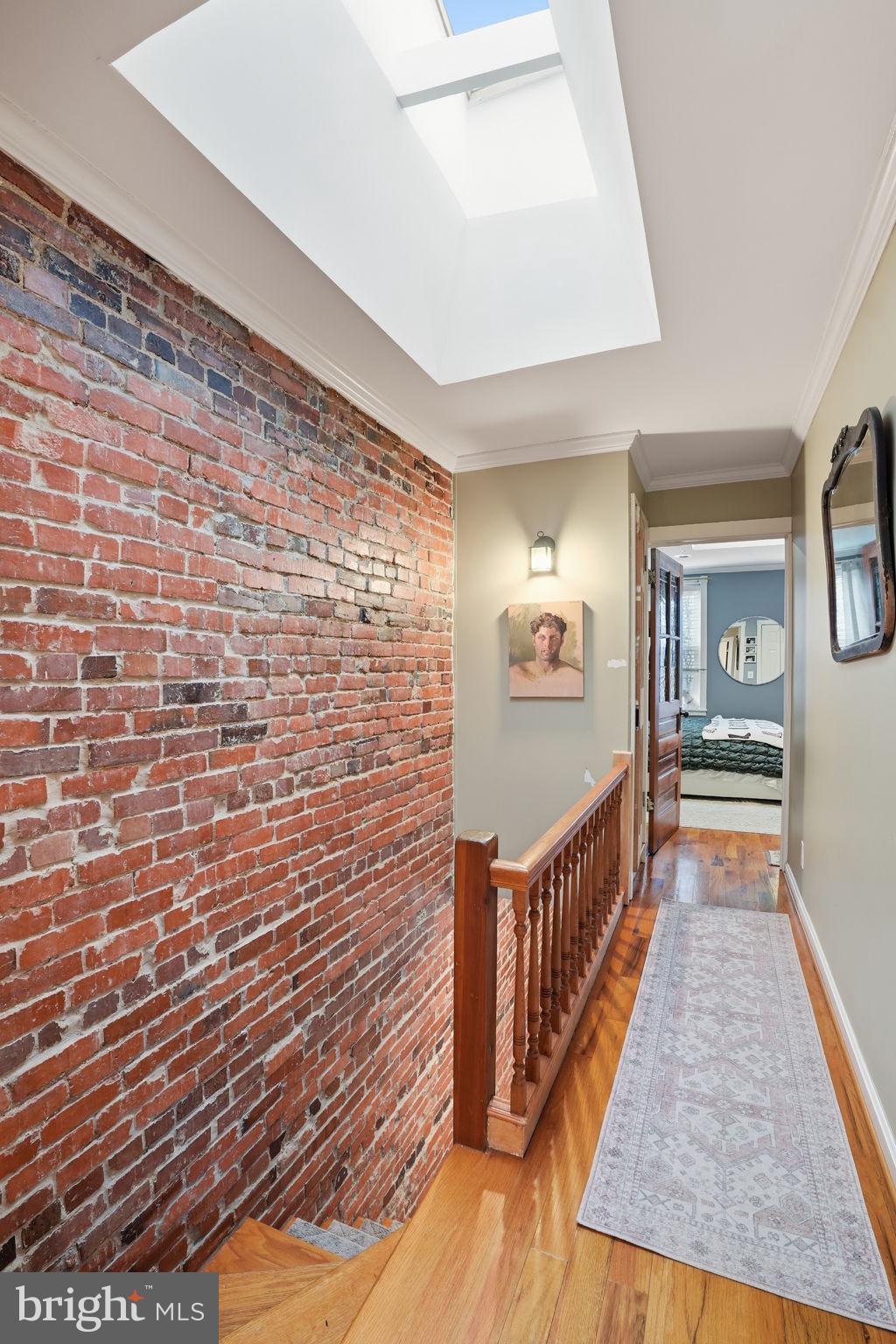 1616 D Street Southeast Washington, DC 20003 - Photo 16 of 37 a view of a hallway with wooden floor and stairs