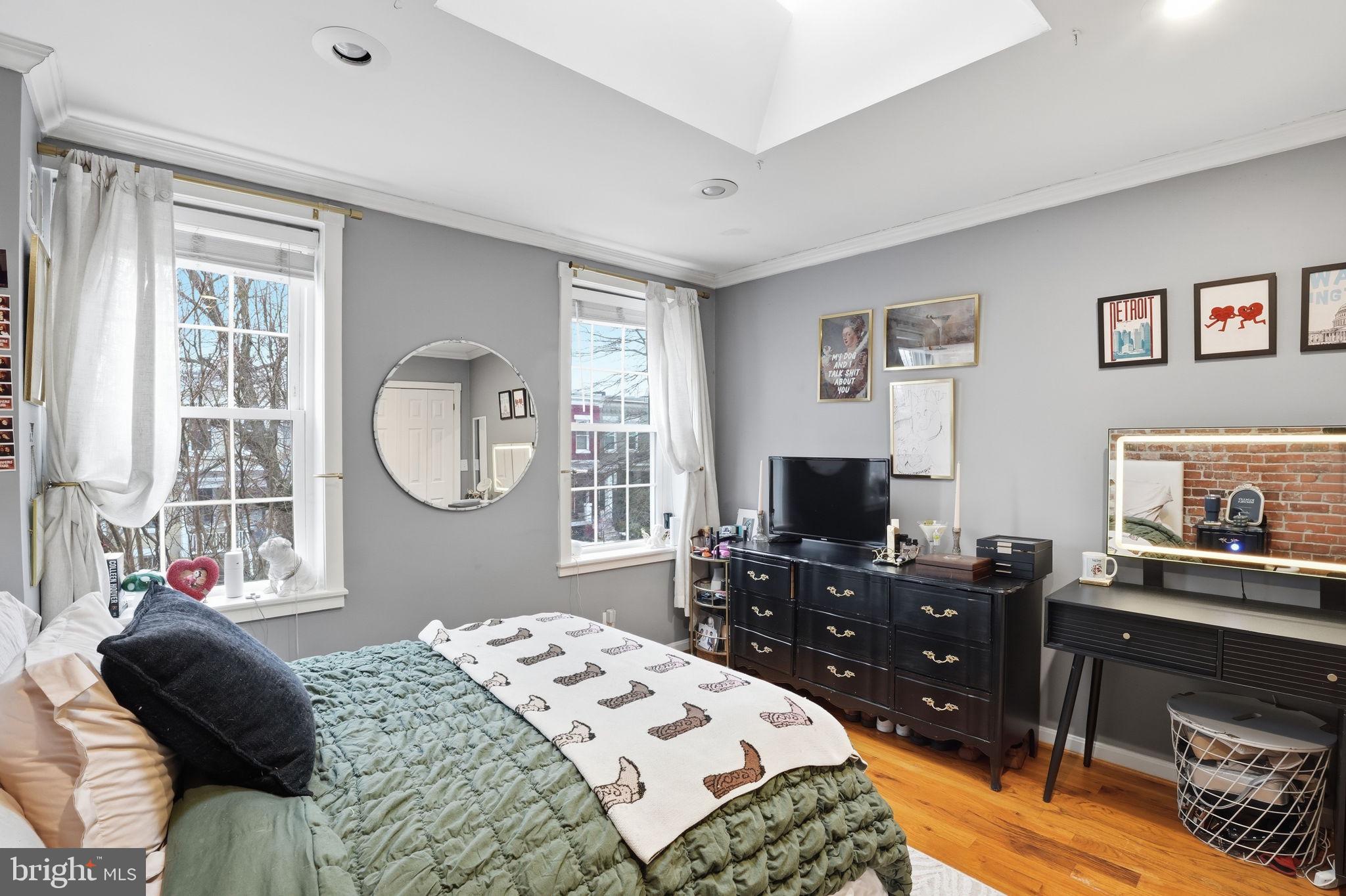 1616 D Street Southeast Washington, DC 20003 - Photo 19 of 37 a bedroom with a bed and a flat screen tv