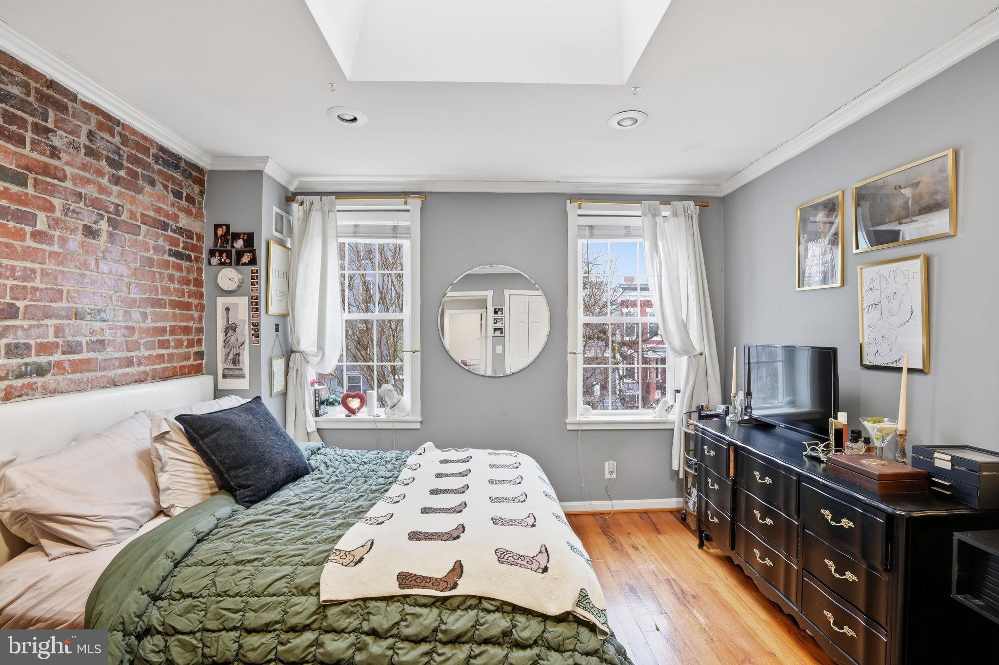 1616 D Street Southeast Washington, DC 20003 - Photo 20 of 37 a bedroom with a bed and a window