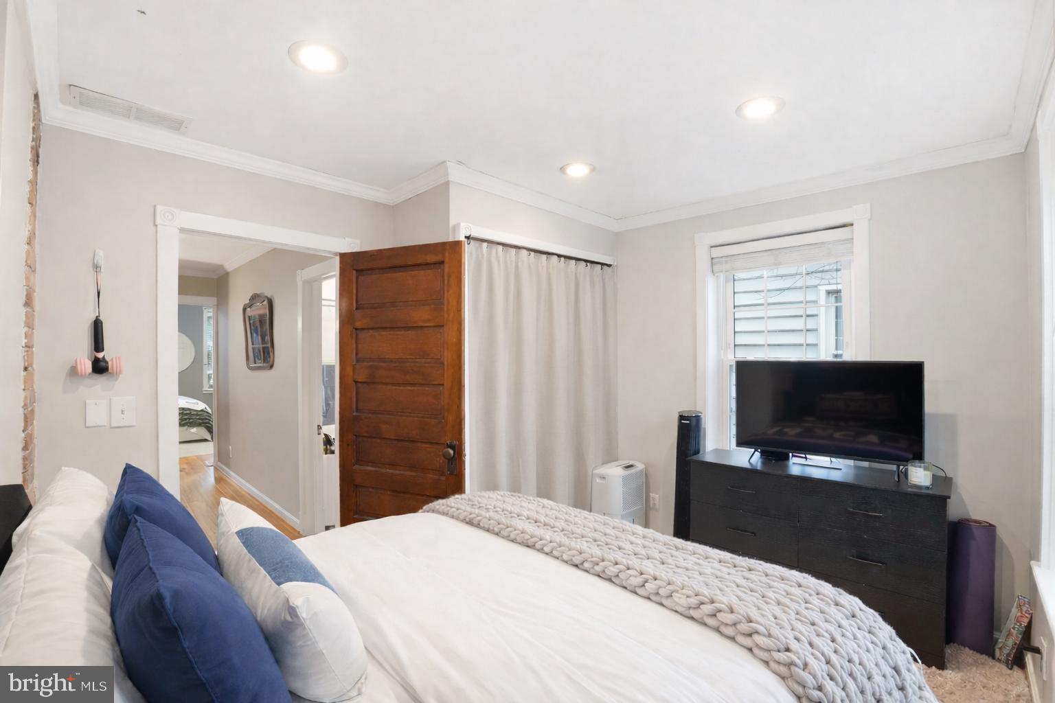 1616 D Street Southeast Washington, DC 20003 - Photo 23 of 37 a bedroom with a bed and a flat screen tv