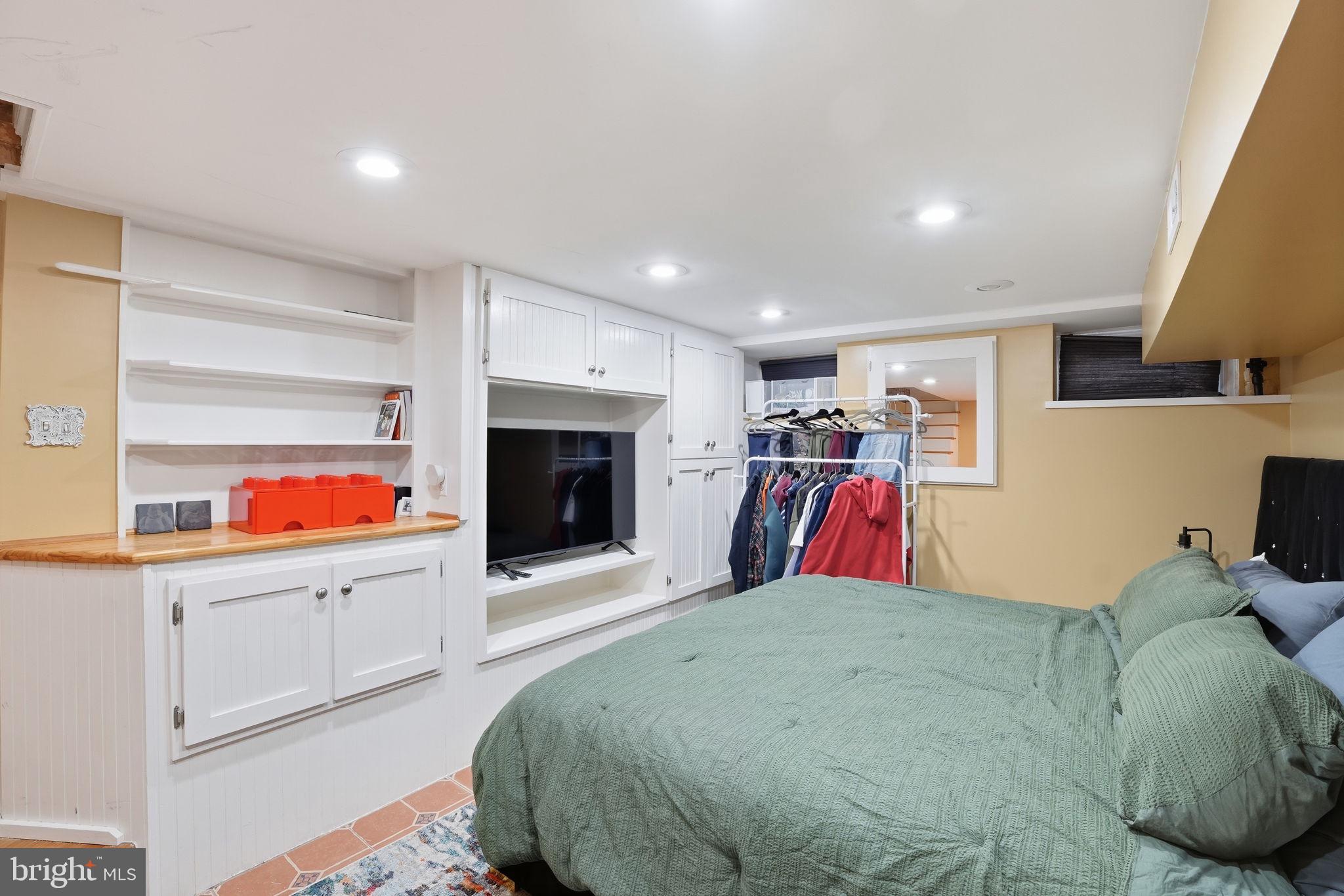 1616 D Street Southeast Washington, DC 20003 - Photo 26 of 37 a bedroom with furniture and white walls