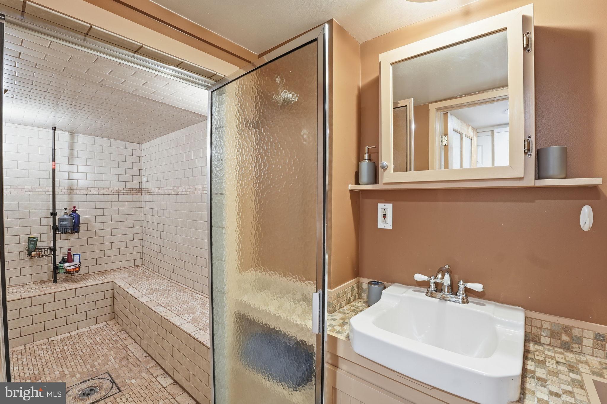 1616 D Street Southeast Washington, DC 20003 - Photo 27 of 37 a bathroom with a bathtub and a sink