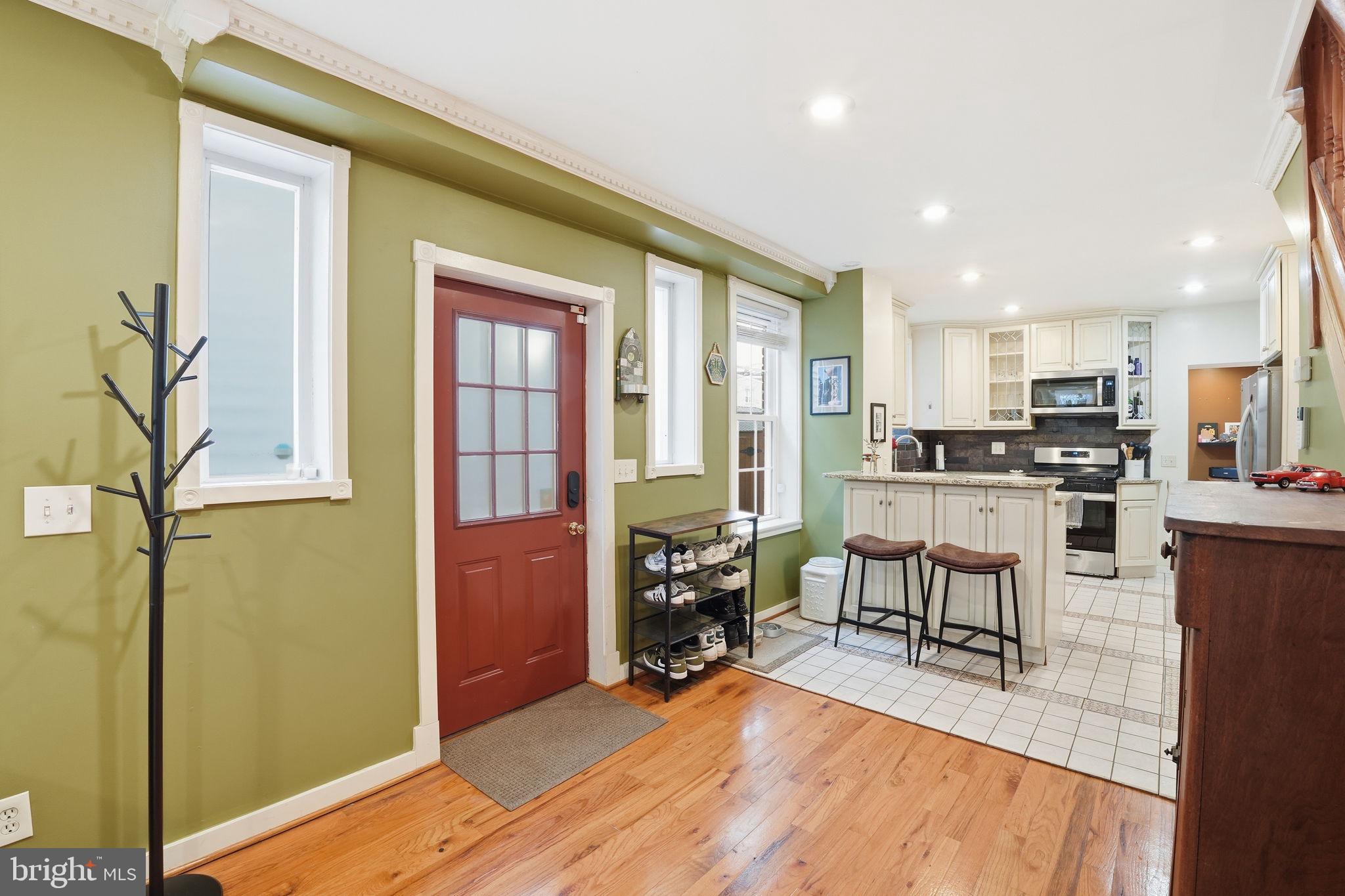 1616 D Street Southeast Washington, DC 20003 - Photo 6 of 37 a view of kitchen with furniture and wooden floor