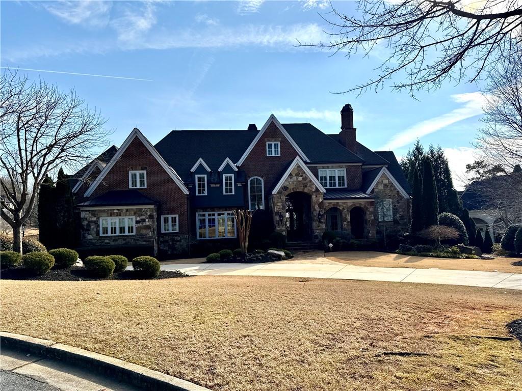 2957 Darlington Run Duluth, GA 30097 - Photo 2 of 58 a front view of house with yard covered in snow