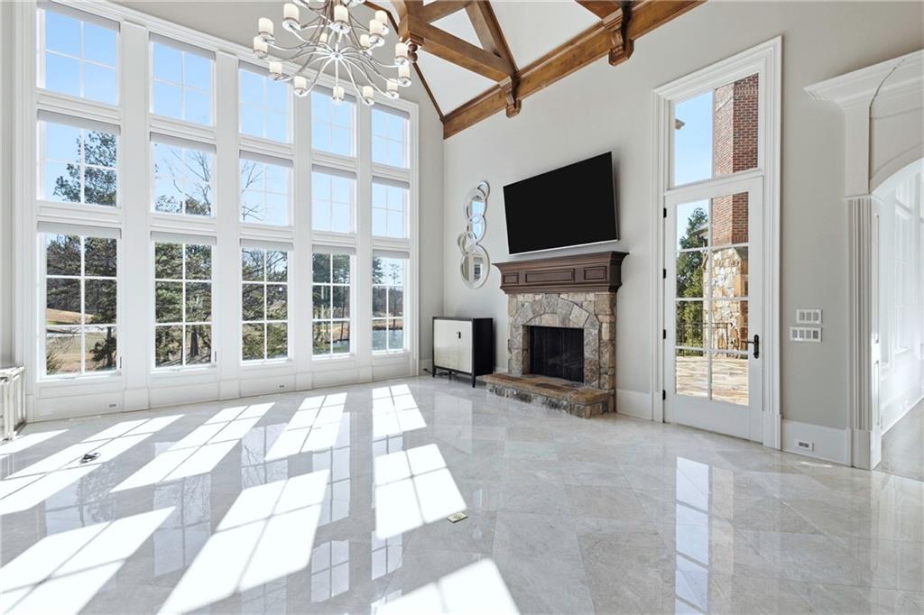 2957 Darlington Run Duluth, GA 30097 - Photo 24 of 58 a living room with fireplace furniture and a flat screen tv