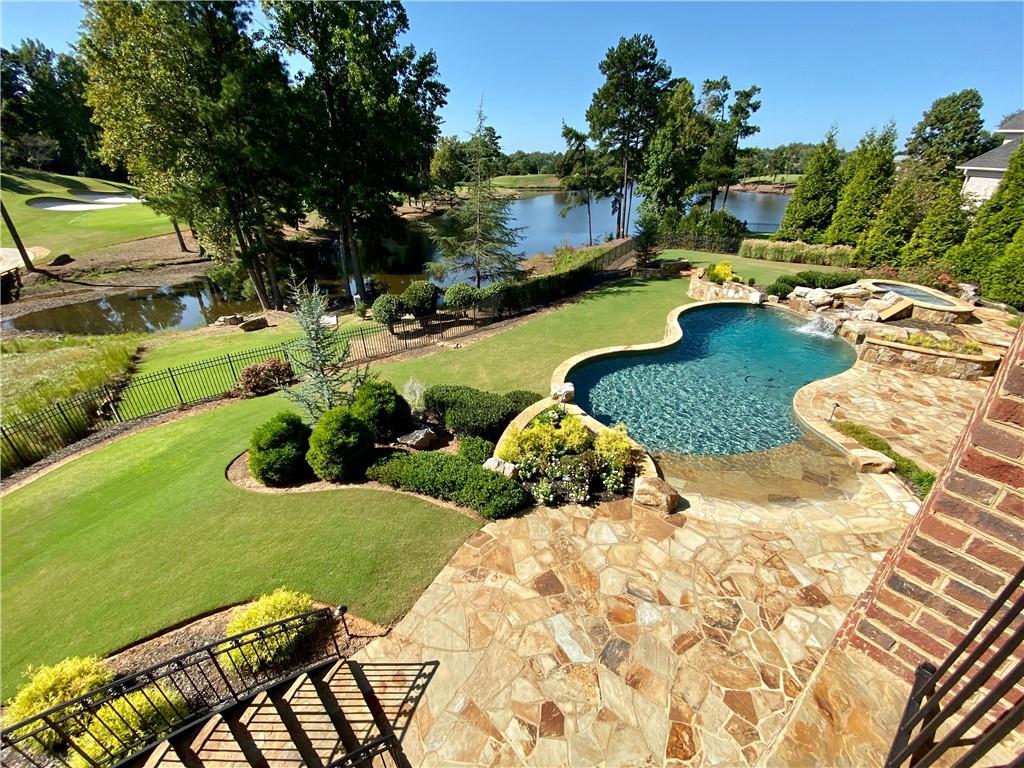 2957 Darlington Run Duluth, GA 30097 - Photo 56 of 58 a view of a swimming pool and lounge chair